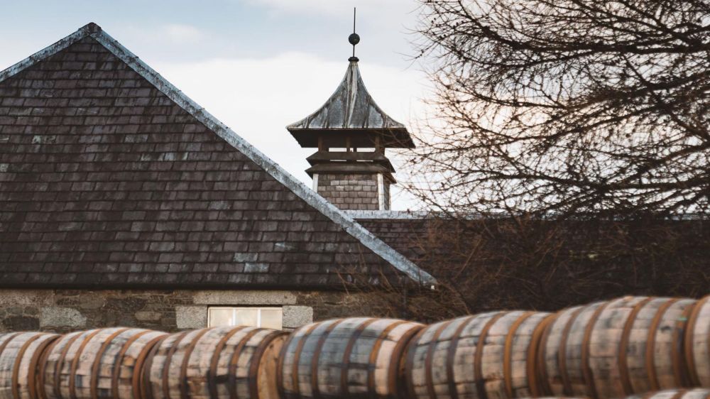 a barrel with a building in the background