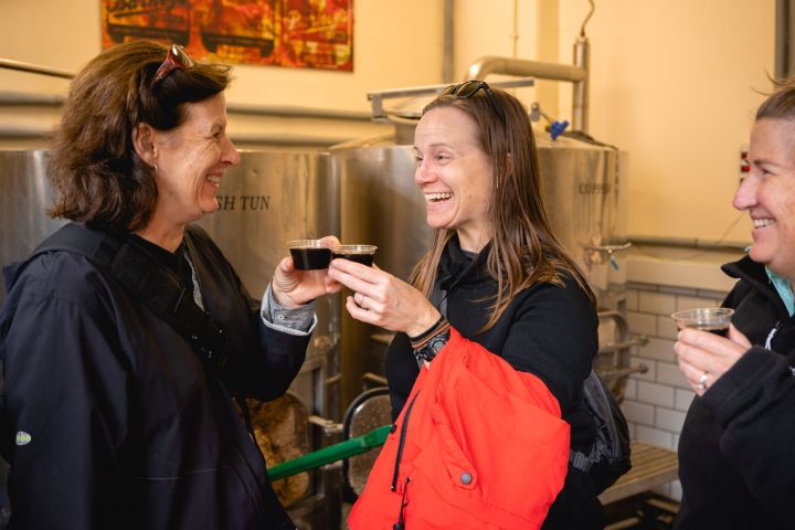 a person drinking a glass of whisky