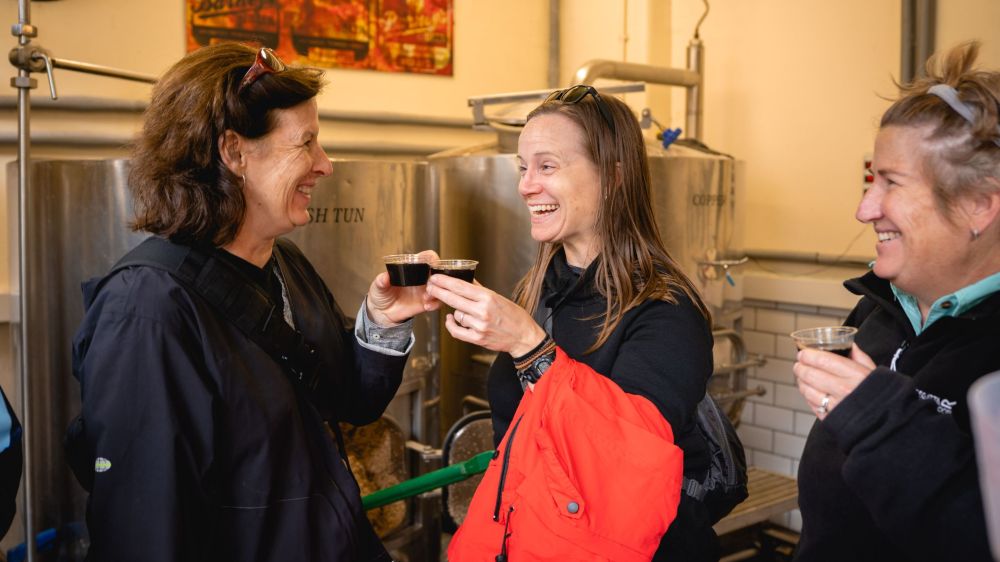 a person drinking a glass of whisky