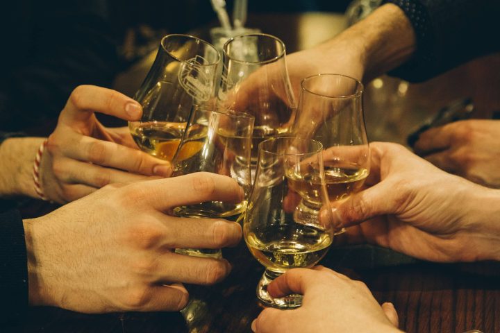 A group of friends enjoying a whisky tour in Scotland