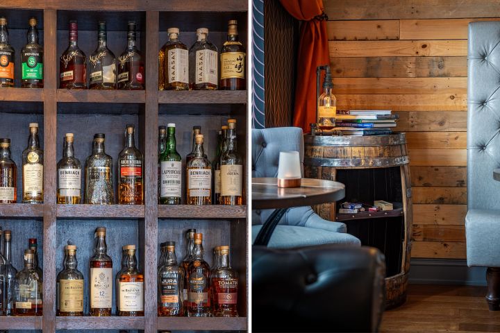 Left: shelf with assorted whiskey bottles, Right: cozy seating area with a barrel table and books.